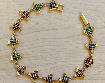 Pulsera vintage Joan Rivers con abeja multicolor en tono dorado. Joyas Joan Rivers. Pulsera de eslabones con abeja de Joan Rivers. Ideas de regalos vintage.