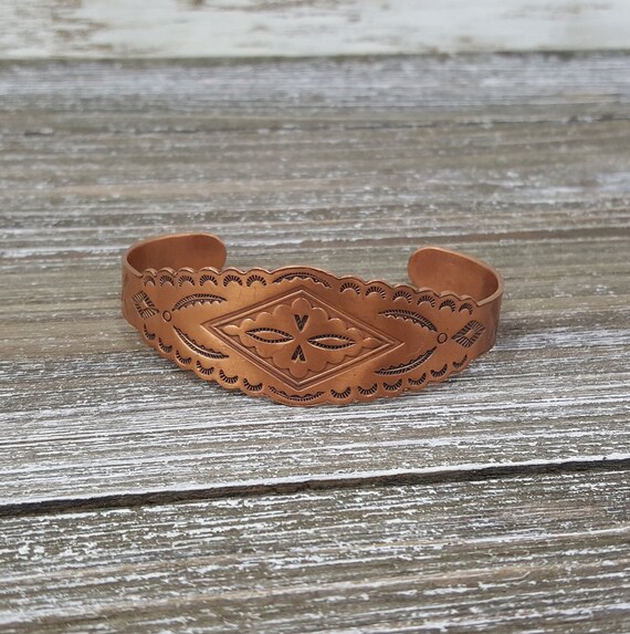 copper bell bracelet