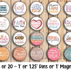 May include: A set of 20 round pins or magnets, each approximately 1 inch in diameter, with inspirational quotes and phrases in various colors and fonts. The pins feature phrases like "God leads" and "Faith over Fear."