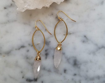 Brass marquise shape with faceted quartz crystal points