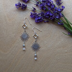 Silver sunburst earrings with clear swarovski crystals and clear quartz points