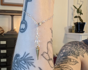 Divination on the go - pendulum bracelet with smaller spike and clear quartz accent