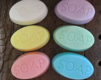May include: Six oval-shaped bars of soap in various pastel colors, each with the word "SOAP" embossed on the top.