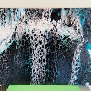 Northern Lights Acrylic Pour Painting on a small canvas board with glittery colors