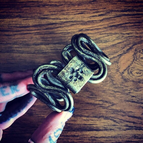 Lower or upper arm bracelet.