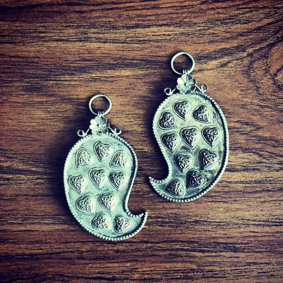 Pair of metal medallions/pendants.