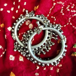 Matched Kuchi bracelets with bells.
