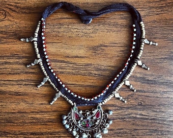 Kuchi "shoelace" necklace.