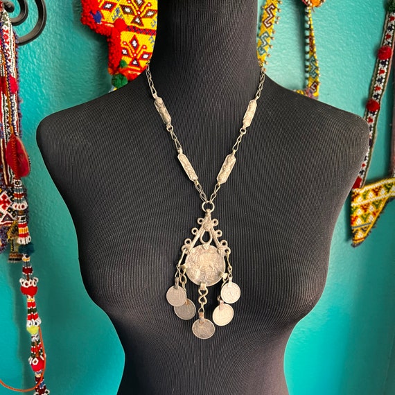 Repurposed coin necklace. 17. Gem