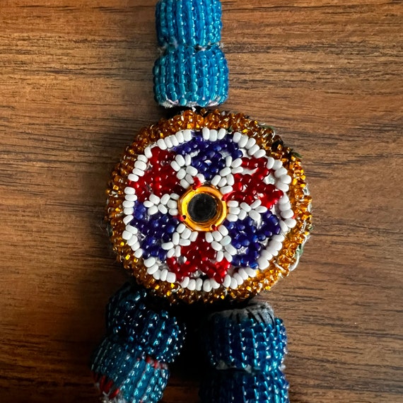 Gul tassel/decoration. View 4