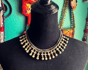 Kuchi "shoelace" necklace.