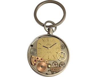 Keyring with dial and OMEGA watch spare parts