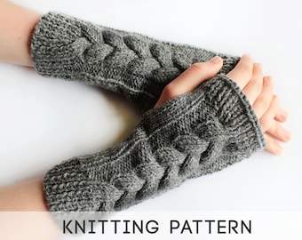 May include: Gray knitted fingerless gloves with a cable knit pattern. The gloves are shown on a person's hands.  KNITTING PATTERN.