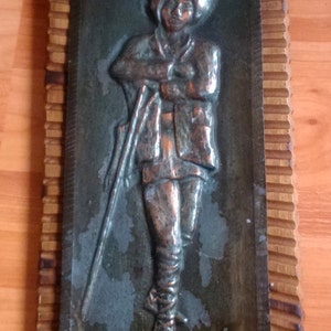 Vintage genuine Romanian herdsman swain wall hanging, home decor, embossed metal on wooden support, 1960s