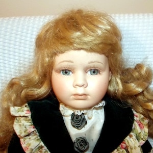 porcelain vintage bisque doll 15.7 inch&#39;s tall marked LEONARDO 81 on neck, velvet dress
