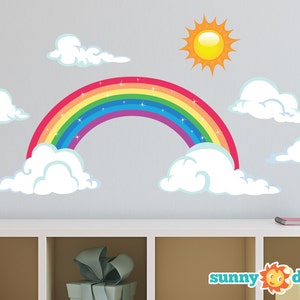 May include: Rainbow wall decal featuring a yellow sun and white clouds. The rainbow has a sparkly effect and is made up of red, orange, yellow, green, blue, indigo, and violet.