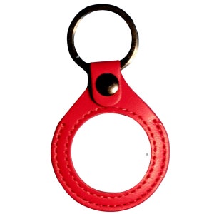 May include: Red leather keychain with a metal ring and a stitched circle in the center.
