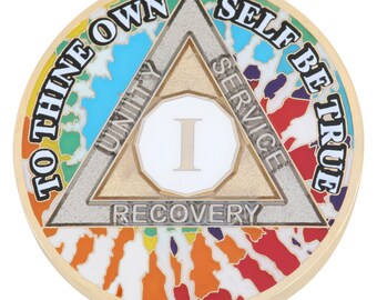 May include: A round, gold-colored coin with a colorful tie-dye pattern around the edge. The coin features a silver triangle with the words "UNITY", "SERVICE", and "RECOVERY". The center has a white circle with the number "I". The words "TO THINE OWN SELF BE TRUE" are around the edge.