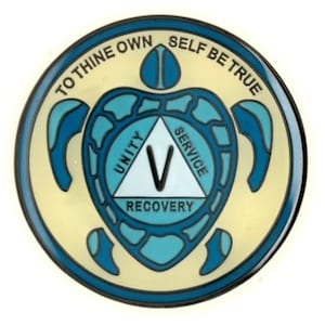 May include: A round, blue and white enamel pin with a turtle design. The turtle is holding a triangle with the words "Unity", "Service", and "Recovery" on it. The words "To Thine Own Self Be True" are written around the outside of the pin.