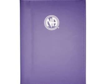 May include: Purple leather-bound journal with the NA logo in white on the front cover.