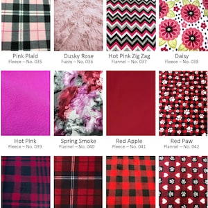 May include: A selection of fabric swatches. Patterns include pink plaid, dusky rose, hot pink zig zag, daisy floral, hot pink fleece, spring smoke, red apple, red paw, red/black plaid, red plaid, red check, and red heart designs.