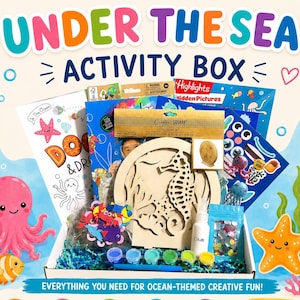 May include: An Under The Sea Activity Box containing various craft supplies, including a wooden seahorse cutout, a bottle of glue, small paint pots, colorful foam shapes, and activity books. The box features the text Under The Sea Activity Box.