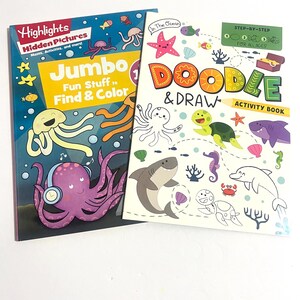 May include: Two activity books with ocean themes. The left book is titled Highlights Hidden Pictures Jumbo Fun Stuff to Find & Color, featuring a purple octopus with headphones. The right book is titled In The Ocean Doodle & Draw Activity Book.
