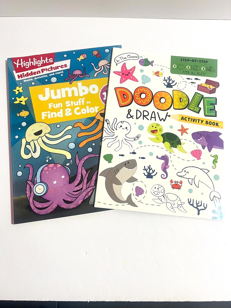 May include: Two activity books with ocean themes. The left book is titled Highlights Hidden Pictures Jumbo Fun Stuff to Find & Color, featuring a purple octopus with headphones. The right book is titled In The Ocean Doodle & Draw Activity Book.
