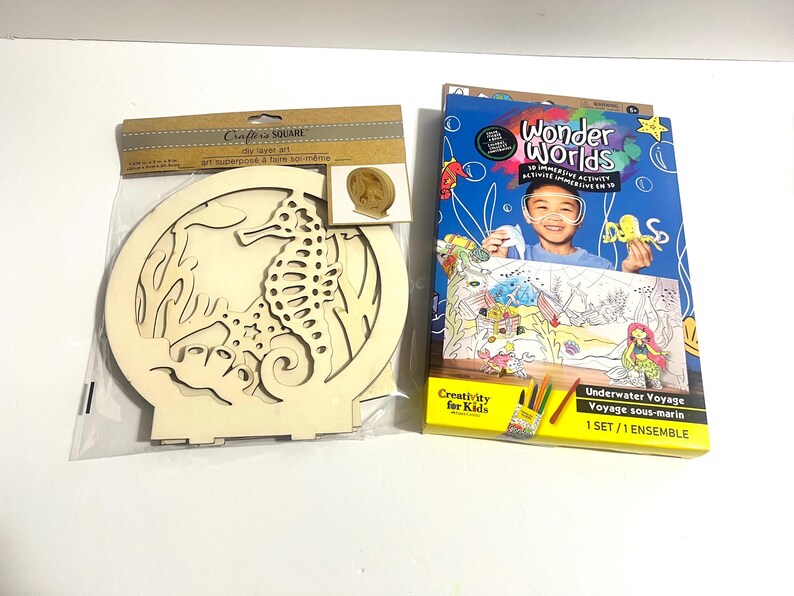 May include: A Crafter's Square DIY layer art kit featuring a wooden seahorse cutout in a circular frame, alongside a Creativity for Kids Wonder Worlds 3D immersive activity set titled Underwater Voyage, which includes coloring materials and a 3D scene.