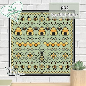 Könnte beinhalten: Ein Kreuzstichmuster mit Bienen, Bienenstöcken und floralen Elementen in Gelb, Schwarz und Orange auf hellgrünem Hintergrund. Das Design enthält den Text "PDF Cross-Stitch Pattern" und "Instant Download".