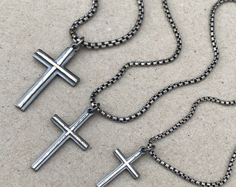 Oxidised solid silver small, standard and medium cross pendants with a polished hammered line detail on a round box chain