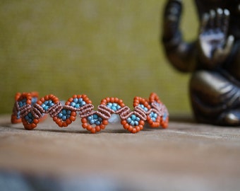 Handcrafted beaded macrame bracelet in blue and orange