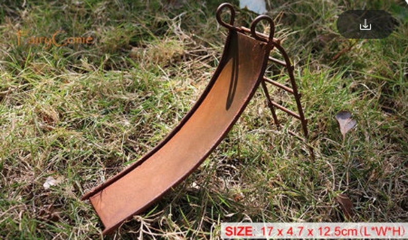 May include: A rusty metal miniature slide and ladder set for a fairy garden. The slide is 17 cm long, 4.7 cm wide, and 12.5 cm high.