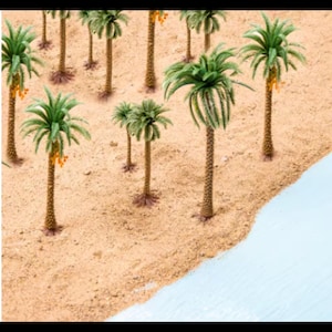 May include: A collection of miniature palm trees in various sizes, arranged on a sandy surface with a blue water edge. The trees are made of green plastic and have brown trunks.