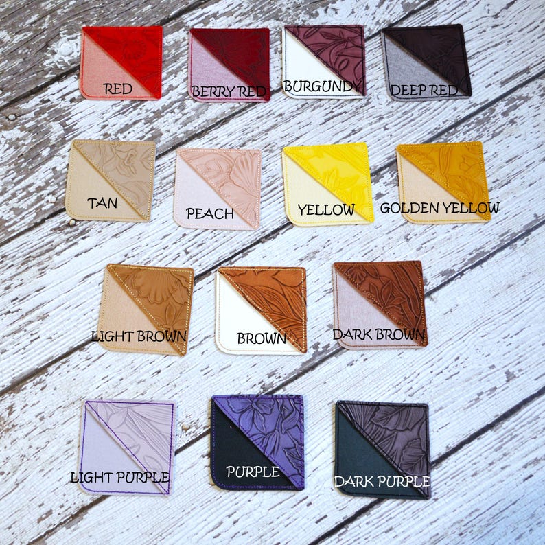 May include: A set of 12 leather corner bookmarks in various colors, including red, berry red, burgundy, deep red, tan, peach, yellow, golden yellow, light brown, brown, dark brown, light purple, purple, and dark purple.