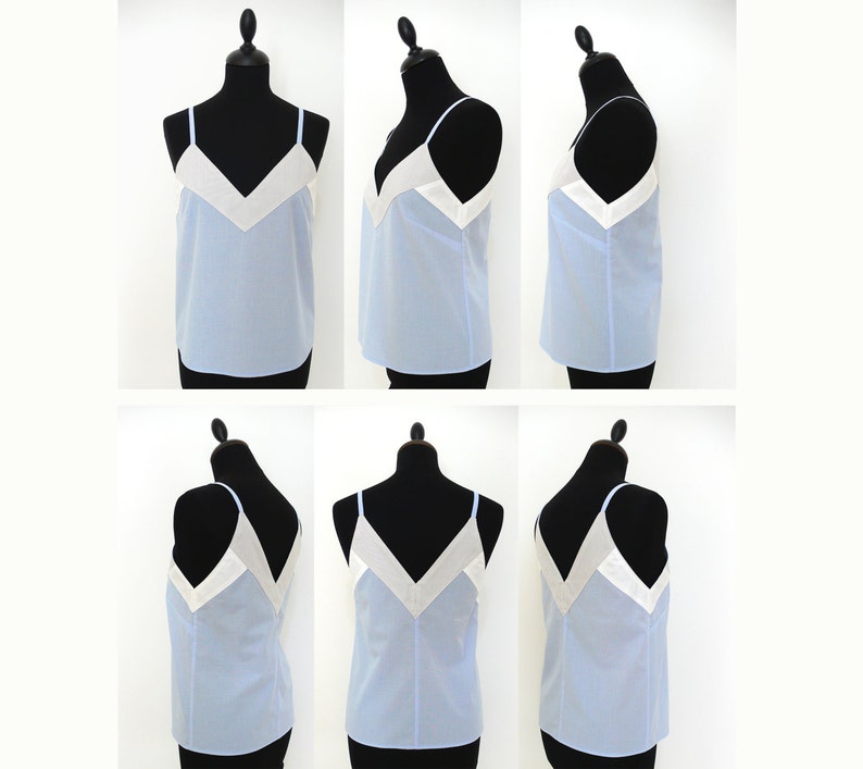 May include: A light blue sleeveless top with a white V-shaped neckline. The top is made of a lightweight fabric and has a relaxed fit.