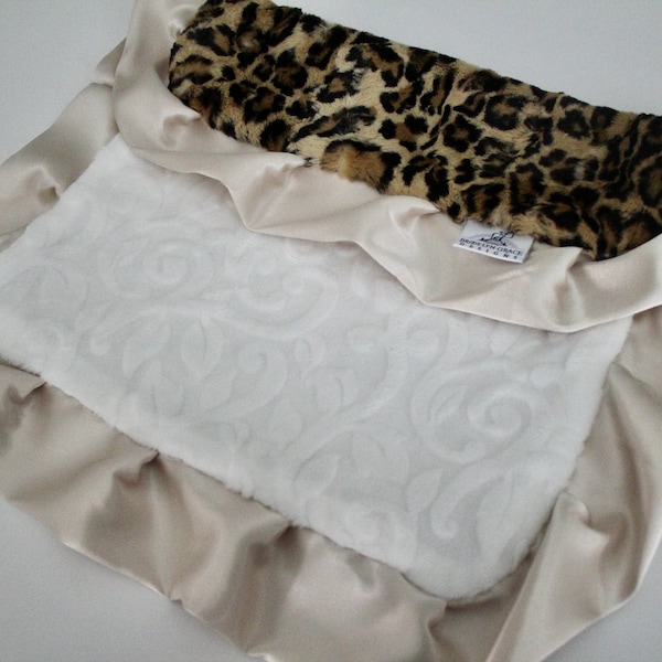 LOVIE Blanket: Leopard Cheetah Print in Sand and Black Minky with White Embossed Vine Minky and finished with a Champagne Gold Satin Trim