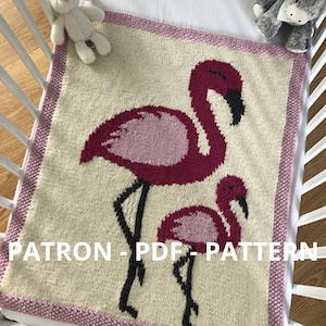 May include: Knitted baby blanket featuring a pink and black flamingo design. The blanket has a pink border and the text "PATRON - PDF - PATTERN" is printed on the bottom.