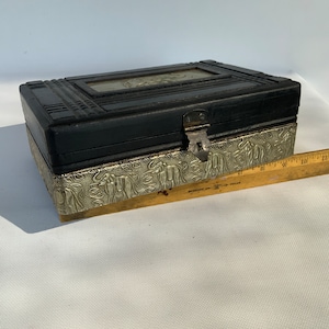 Wood embossed box with silver toned, embossed, elephant patterns in laid