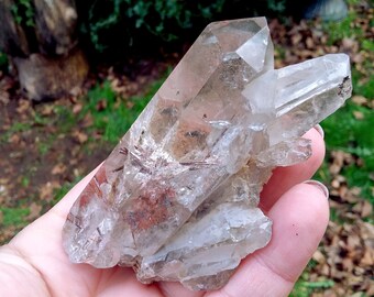 Red epidote rutilated hair quartz crystal cluster specimen