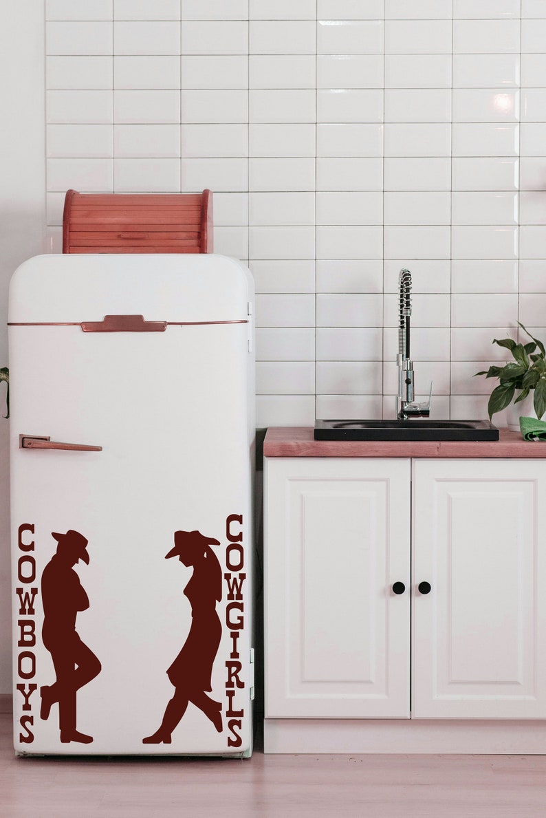 Western wall art styled as a restroom door sign, a cowboy and cowgirl silhouette design that fits rustic farmhouse bathrooms.