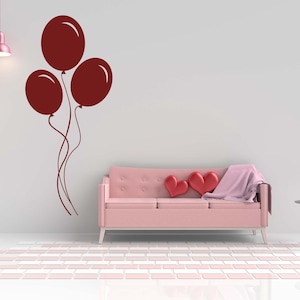 Nursery wall art showcasing three balloons in silhouette, offering a joyful and dreamy feel.