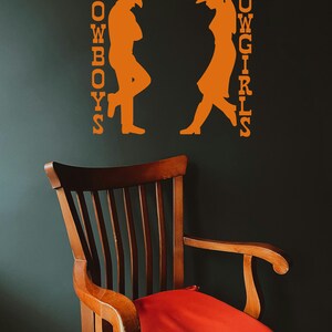 Cowgirl wall art shown as a restroom door vinyl sticker, styled for farmhouse, rustic, or western bathroom decoration.