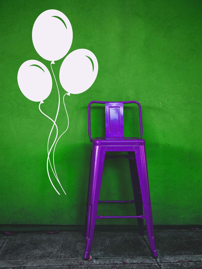 Balloon wall decal featuring three floating balloons with curling strings, perfect for a playful and cheerful kid's space. Vinyl decals featuring a trio of helium-like balloons that appear to be floating together. Displayed as door sign decals, window stickers, and various examples of balloon wall decor.