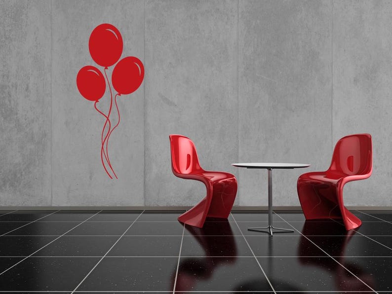 Silhouette art of clustered balloons adds lightness and movement to any youth-inspired wall display.