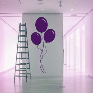 Wall decal of drifting party balloons, a playful nod to celebration and wonder.