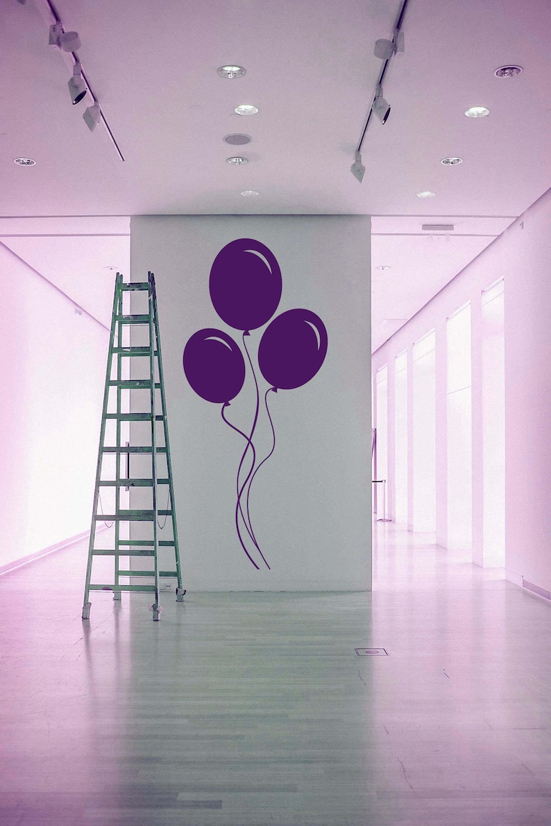 Wall decal of drifting party balloons, a playful nod to celebration and wonder.