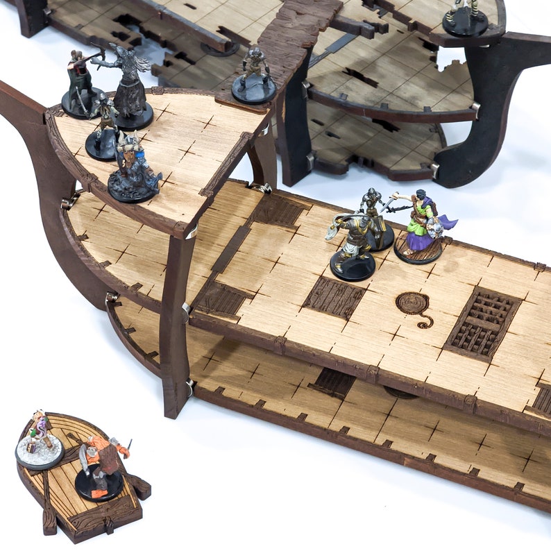 May include: A wooden ship model with multiple levels and a small boat. The ship is painted brown and has a weathered look. There are several miniature figures on the ship, including a knight, a wizard, and a goblin.