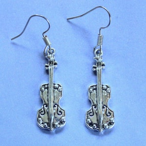 May include: A pair of silver dangle earrings featuring a detailed violin design. The earrings have a hook fastening.