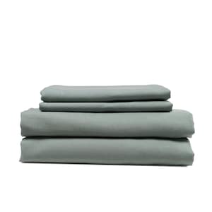 May include: A stack of four sage green cotton bed sheets.
